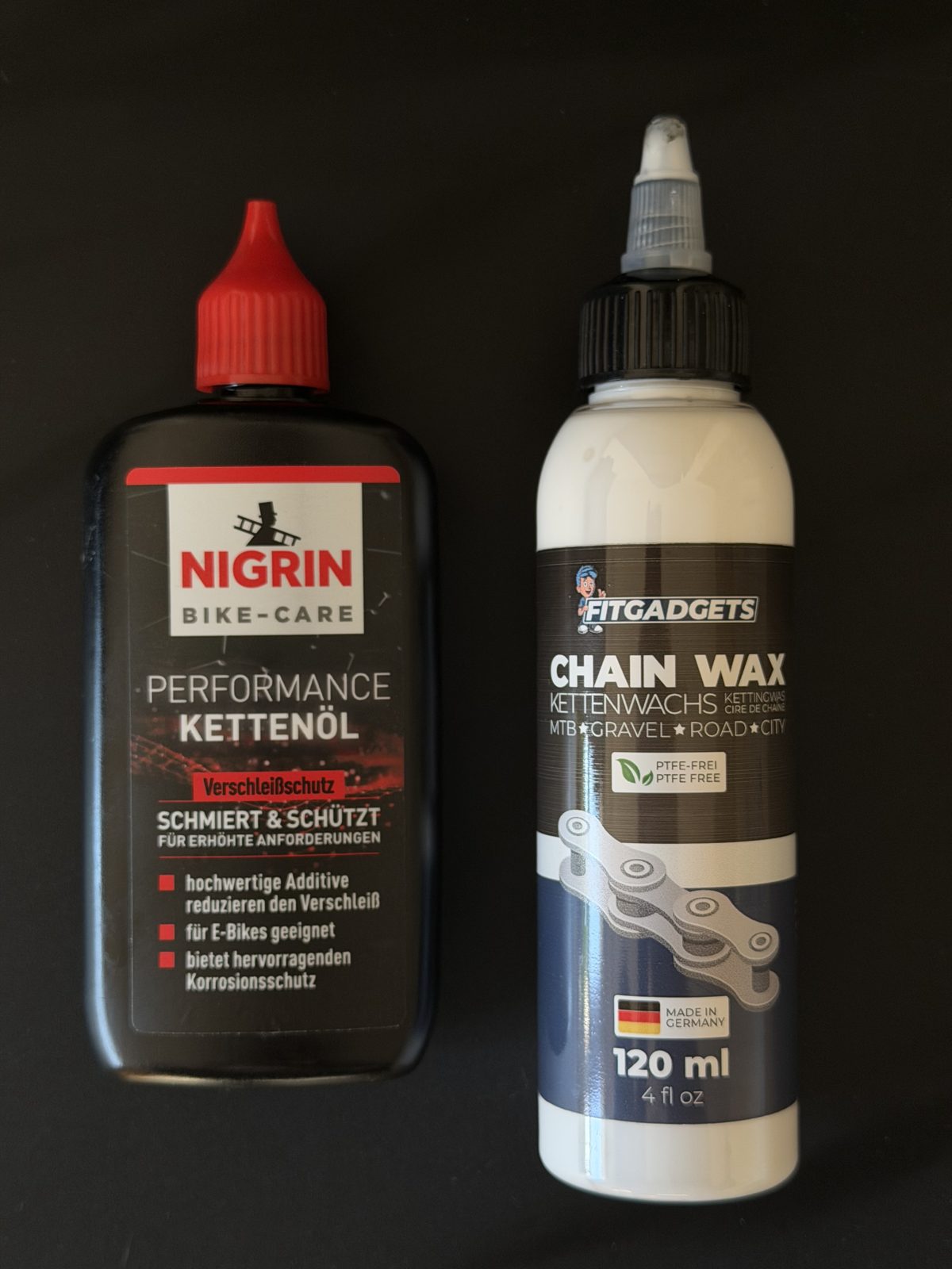 Nigrin Performance Kettenöl und Fitgadgets Chain Wax nebeneinander – Öl vs. Wachs fürs E-MTB